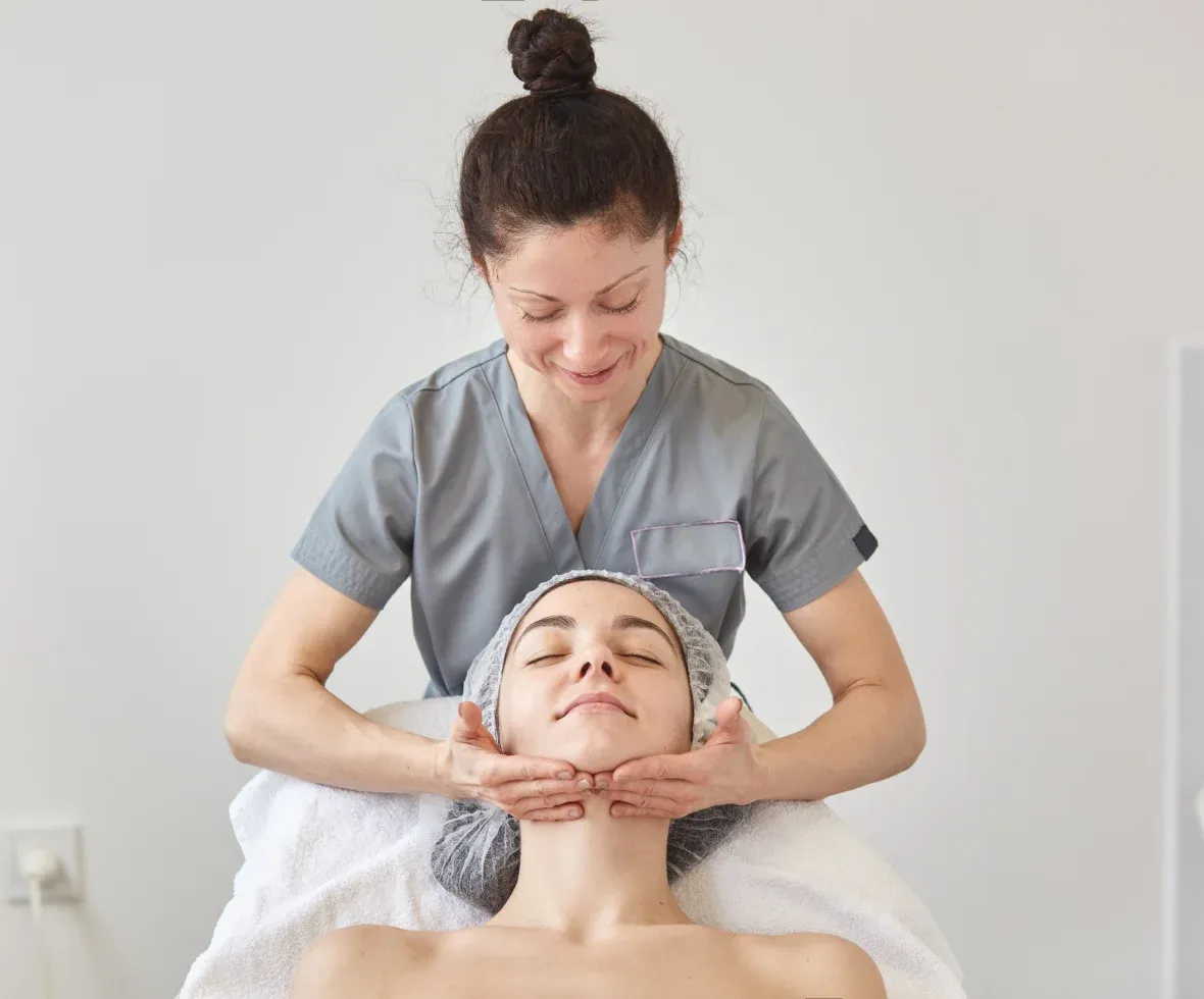 Therapist giving a relaxing facial
