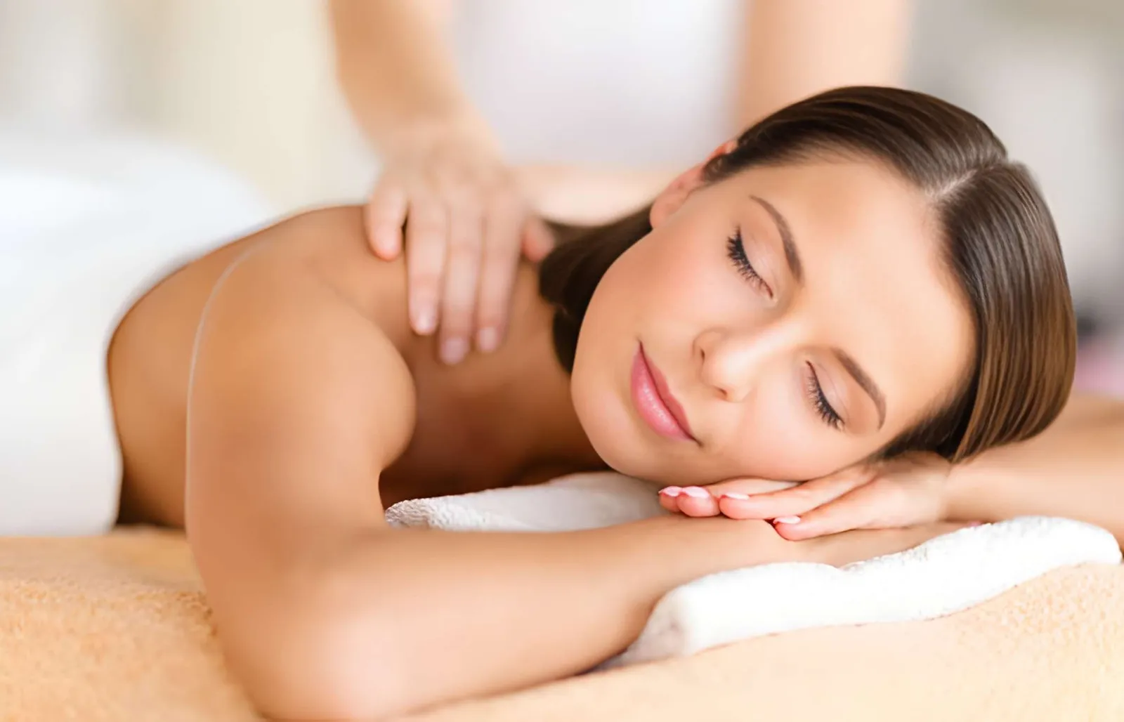 Woman relaxing during a back massage